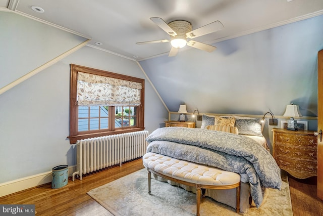 2305 S Inge St S, Arlington, VA 22202 - bedroom featuring radiator heating unit, wood finished floors, lofted ceiling, baseboards, and ceiling fan