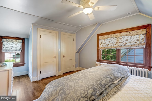 2305 S Inge St S, Arlington, VA 22202 - bedroom featuring radiator heating unit, wood finished floors, vaulted ceiling, baseboards, and ceiling fan