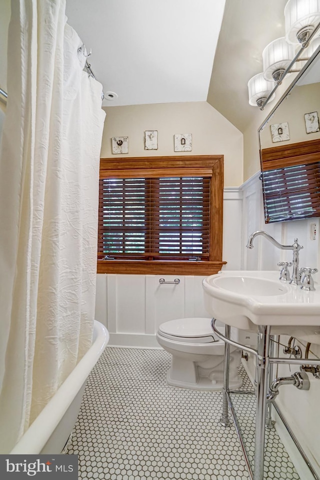 2305 S Inge St S, Arlington, VA 22202 - bathroom featuring toilet, wainscoting, and a sink