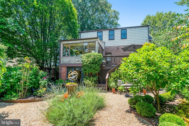 2305 S Inge St S, Arlington, VA 22202 - view of front facade with a deck, brick siding, and stairs