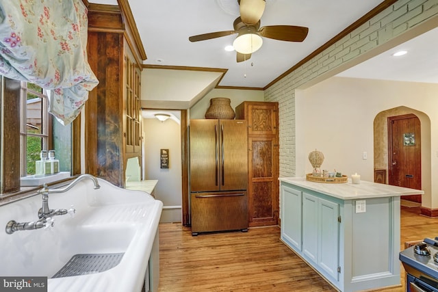 2305 S Inge St S, Arlington, VA 22202 - bathroom with crown molding, a sink, a ceiling fan, and wood finished floors