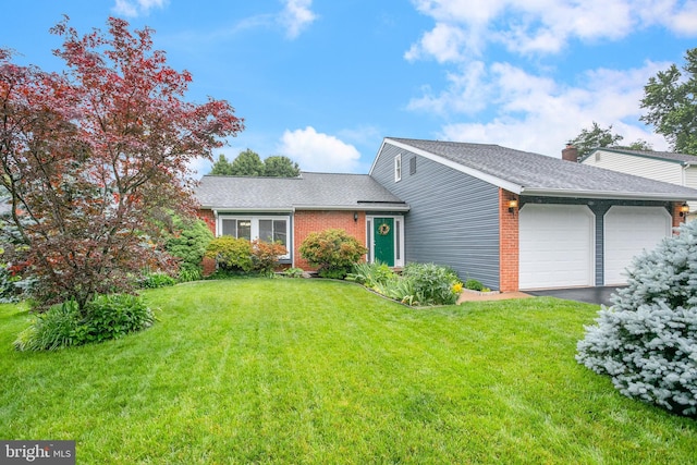 261 E Juniper Ave, Sterling, VA 20164 - view of front facade featuring a garage, a front yard, brick siding, asphalt driveway, and roof with shingles