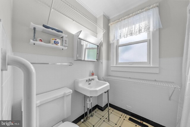 2034 Beach Blvd, Point Pleasant Boro, NJ 08742 - bathroom featuring tile walls, a wainscoted wall, toilet, tile patterned floors, and ornamental molding