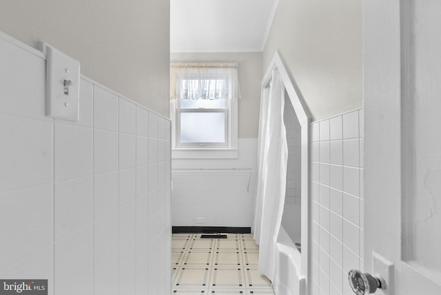 2034 Beach Blvd, Point Pleasant Boro, NJ 08742 - bathroom with tile walls, ornamental molding, a wainscoted wall, shower / bathtub combination with curtain, and tile patterned floors
