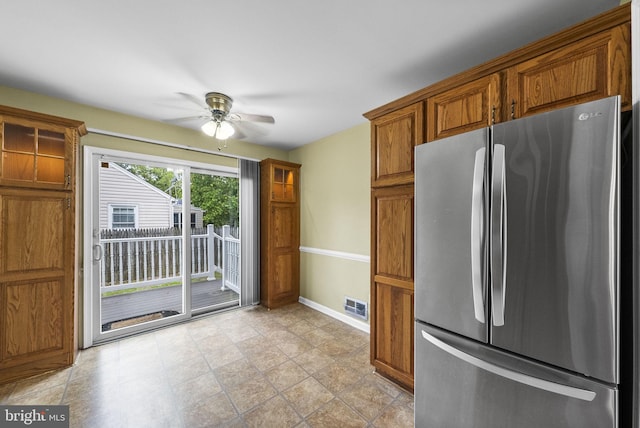 2034 Beach Blvd, Point Pleasant Boro, NJ 08742 - kitchen with freestanding refrigerator, brown cabinetry, ceiling fan, and baseboards