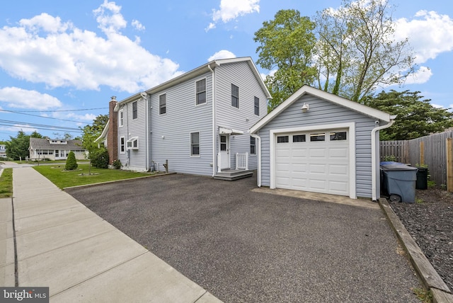 2034 Beach Blvd, Point Pleasant Boro, NJ 08742 - back of house with an outdoor structure, a garage, and driveway