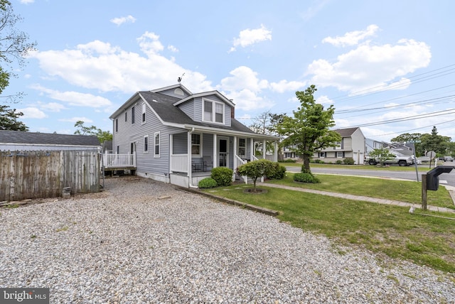 2034 Beach Blvd, Point Pleasant Boro, NJ 08742 - view of front facade featuring covered porch, a shingled roof, and driveway