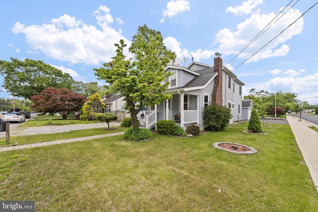 2034 Beach Blvd, Point Pleasant Boro, NJ 08742 - view of front of house featuring covered porch, a chimney, a front lawn, and a shingled roof