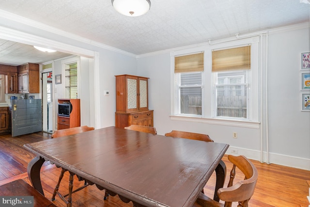 1751 Temple Ave, Lancaster, PA 17603 - dining area featuring dark wood-style flooring, baseboards, ornamental molding, and an ornate ceiling