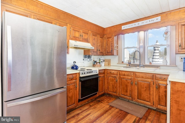 1751 Temple Ave, Lancaster, PA 17603 - kitchen featuring freestanding refrigerator, a sink, under cabinet range hood, electric stove, and light countertops