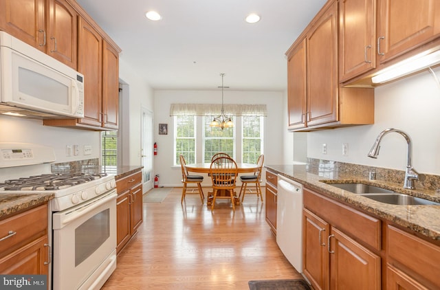 1402 Joppa Forest Dr Unit 7, Joppa, MD 21085 - kitchen with white appliances, a sink, light stone countertops, light wood finished floors, and a chandelier