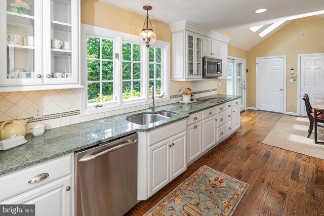 4582 Province Line, Princeton, NJ 08540 - kitchen with stainless steel appliances, a sink, lofted ceiling, white cabinetry, and decorative backsplash