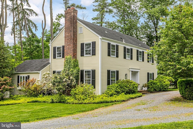 4582 Province Line, Princeton, NJ 08540 - view of home's exterior featuring a chimney, a shingled roof, and a yard