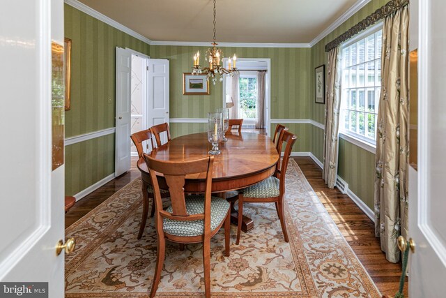 4582 Province Line, Princeton, NJ 08540 - dining area featuring wood finished floors, a chandelier, wallpapered walls, ornamental molding, and baseboards