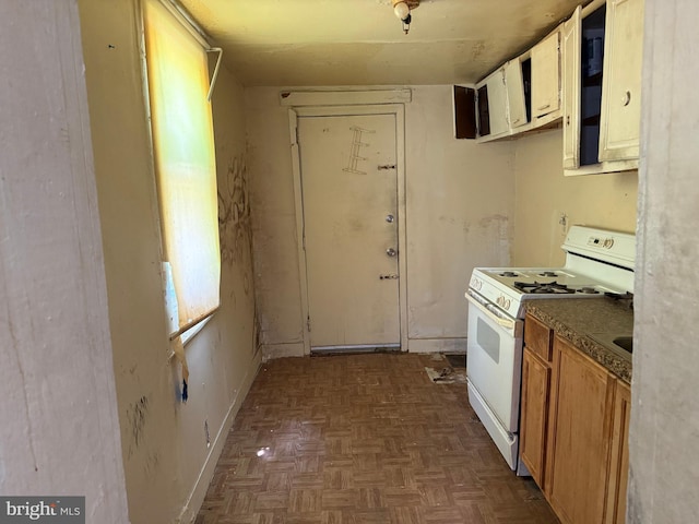 1310 Edmondson Ave, Baltimore, MD 21223 - kitchen featuring white stove and baseboards