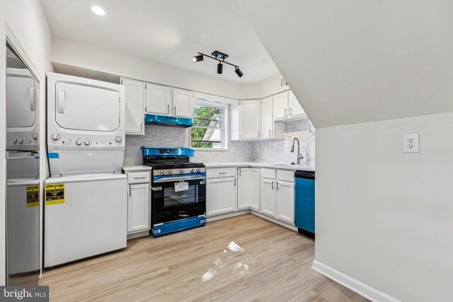135 Polk Dr, Manassas Park, VA 20111 - kitchen featuring stainless steel gas range oven, stacked washer / dryer, dishwasher, a sink, and under cabinet range hood