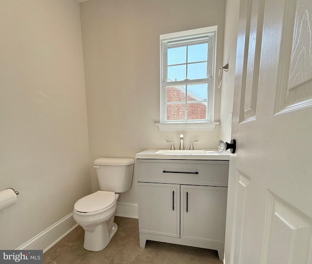 31 W Whitlock Ave, Winchester, VA 22601 - bathroom with toilet, baseboards, vanity, and tile patterned flooring