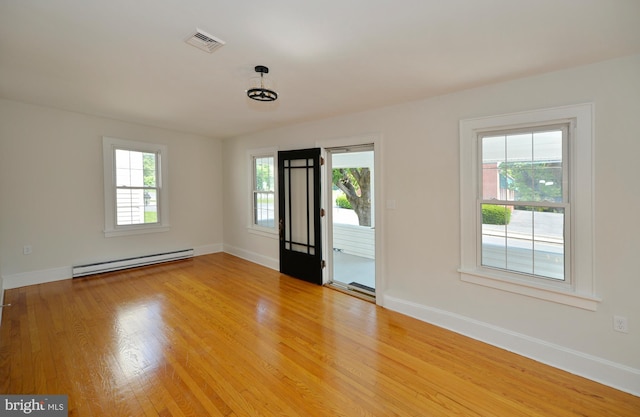 31 W Whitlock Ave, Winchester, VA 22601 - unfurnished room with a baseboard radiator, baseboards, and light wood finished floors
