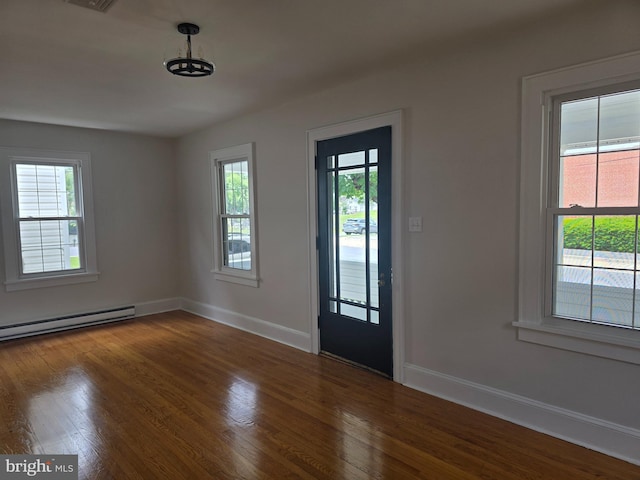 31 W Whitlock Ave, Winchester, VA 22601 - foyer featuring healthy amount of natural light, a baseboard heating unit, wood finished floors, and baseboards