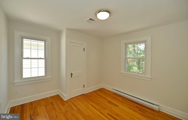 31 W Whitlock Ave, Winchester, VA 22601 - empty room featuring baseboard heating, light wood-style flooring, and baseboards