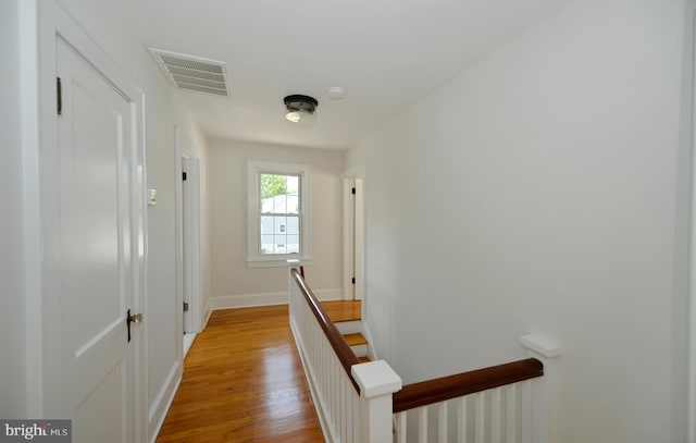 31 W Whitlock Ave, Winchester, VA 22601 - hall with an upstairs landing, baseboards, and light wood-style flooring