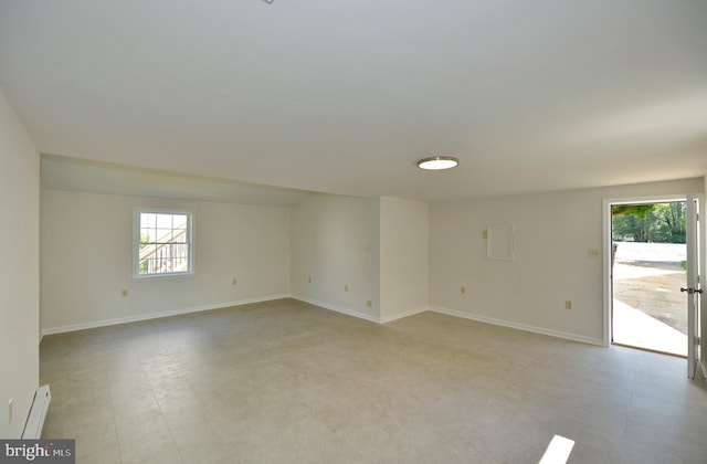 31 W Whitlock Ave, Winchester, VA 22601 - unfurnished room featuring plenty of natural light, a baseboard heating unit, and baseboards