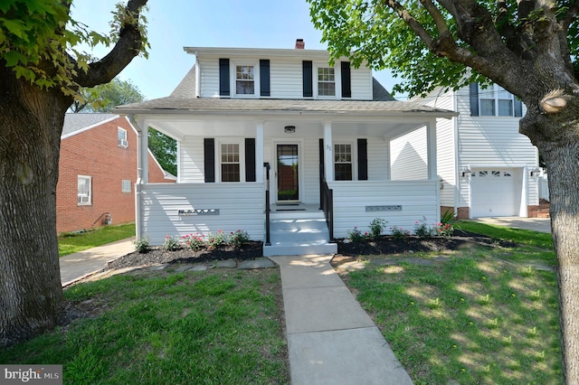 31 W Whitlock Ave, Winchester, VA 22601 - bungalow with covered porch, roof with shingles, a front yard, and a chimney