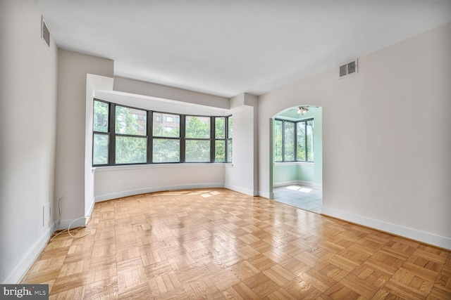 2515 K St NW Unit 205, Washington, DC 20037 - unfurnished room featuring baseboards and arched walkways
