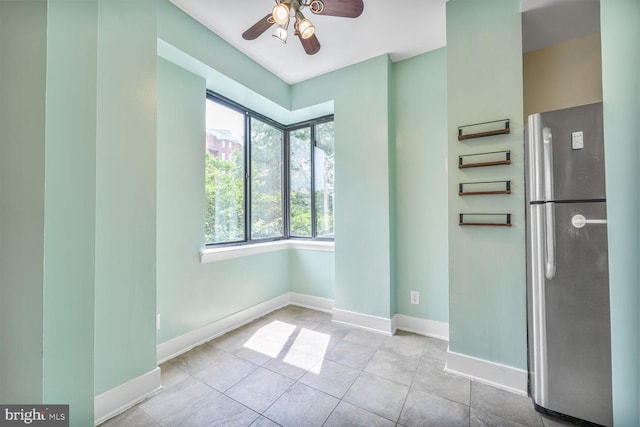 2515 K St NW Unit 205, Washington, DC 20037 - tiled spare room with ceiling fan and baseboards