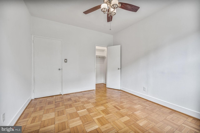 2515 K St NW Unit 205, Washington, DC 20037 - unfurnished bedroom with baseboards, a ceiling fan, and a closet