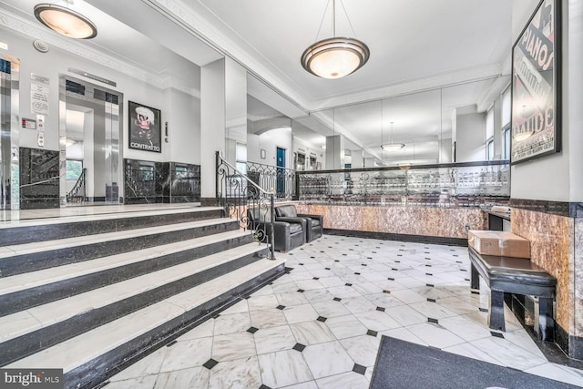 2515 K St NW Unit 205, Washington, DC 20037 - reception with wainscoting, ornamental molding, and stairway