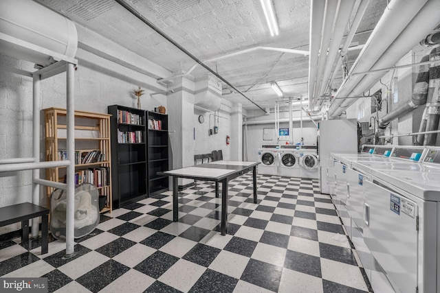 2515 K St NW Unit 205, Washington, DC 20037 - basement featuring washer and clothes dryer and tile patterned floors