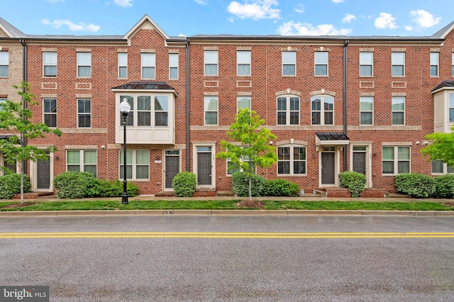 229 S Macon St, Baltimore, MD 21224 - townhome / multi-family property featuring brick siding