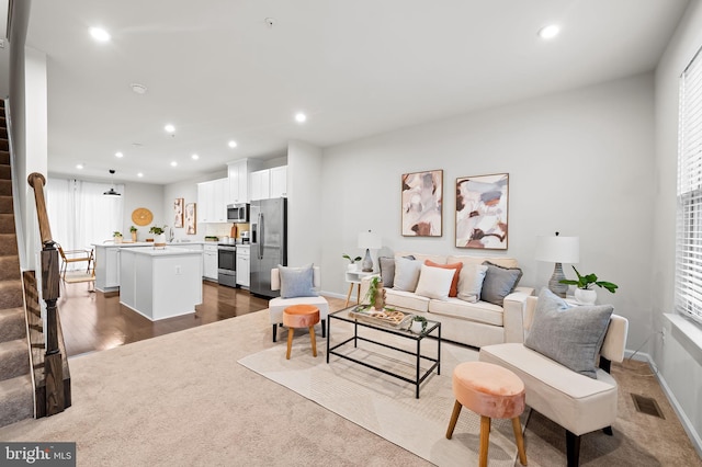 229 S Macon St, Baltimore, MD 21224 - living room with stairway, recessed lighting, baseboards, healthy amount of natural light, and dark wood finished floors