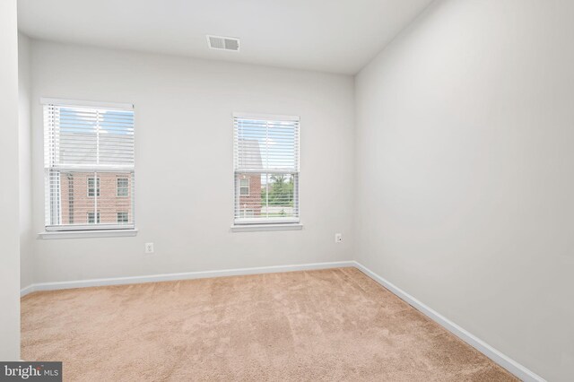229 S Macon St, Baltimore, MD 21224 - empty room with carpet floors and baseboards