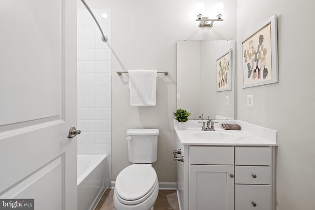 229 S Macon St, Baltimore, MD 21224 - bathroom with vanity, toilet, bathtub / shower combination, and baseboards