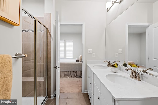 229 S Macon St, Baltimore, MD 21224 - full bathroom featuring double vanity, tile patterned floors, a shower stall, and ensuite bath