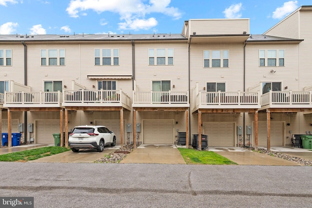 229 S Macon St, Baltimore, MD 21224 - back of property with an attached garage, driveway, and central air condition unit