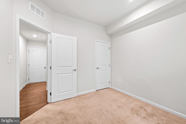 229 S Macon St, Baltimore, MD 21224 - unfurnished bedroom featuring carpet and baseboards