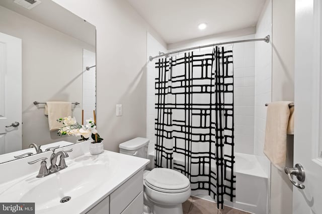 229 S Macon St, Baltimore, MD 21224 - bathroom with vanity, shower / tub combo, and toilet