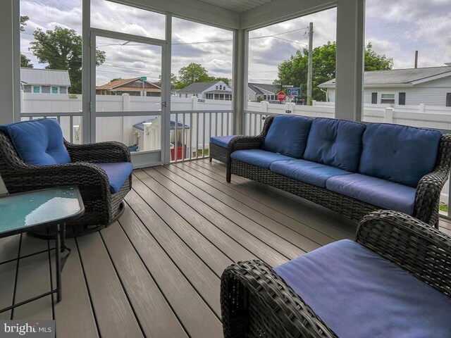 37529 Atlantic Ave Unit 11, Rehoboth Beach, DE 19971 - sunroom / solarium with outdoor lounge area and healthy amount of natural light