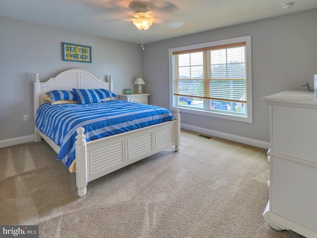 37529 Atlantic Ave Unit 11, Rehoboth Beach, DE 19971 - bedroom with light colored carpet, baseboards, and ceiling fan