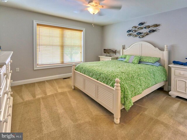 37529 Atlantic Ave Unit 11, Rehoboth Beach, DE 19971 - bedroom featuring light carpet, baseboards, and ceiling fan