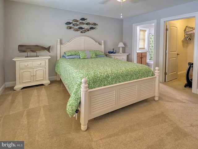 37529 Atlantic Ave Unit 11, Rehoboth Beach, DE 19971 - bedroom with light carpet, baseboards, a walk in closet, and a ceiling fan