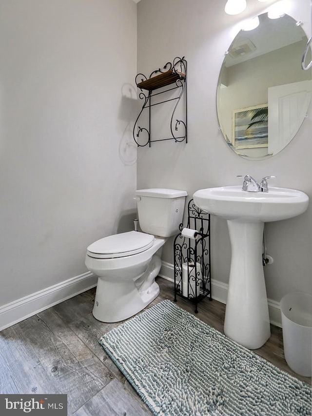 37529 Atlantic Ave Unit 11, Rehoboth Beach, DE 19971 - bathroom featuring wood finished floors, toilet, and baseboards