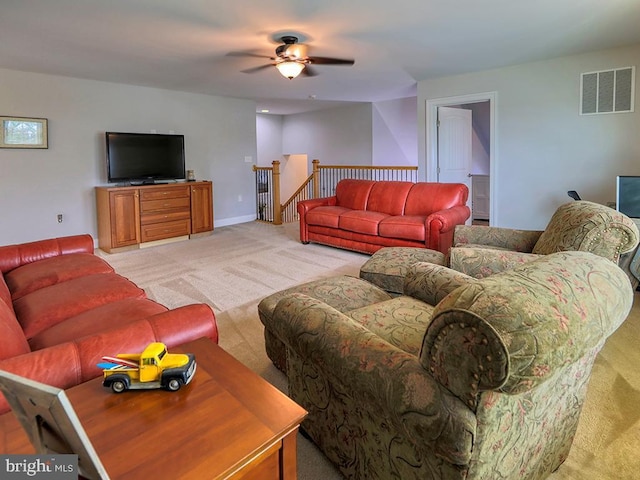 37529 Atlantic Ave Unit 11, Rehoboth Beach, DE 19971 - living area with light colored carpet, a ceiling fan, and baseboards