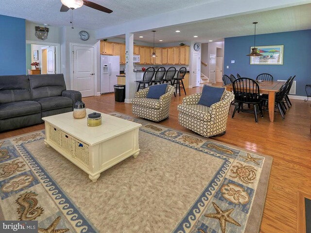 37529 Atlantic Ave Unit 11, Rehoboth Beach, DE 19971 - living room featuring a ceiling fan, wood finished floors, recessed lighting, and baseboards