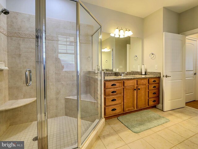 37529 Atlantic Ave Unit 11, Rehoboth Beach, DE 19971 - bathroom with vanity, a stall shower, and tile patterned flooring