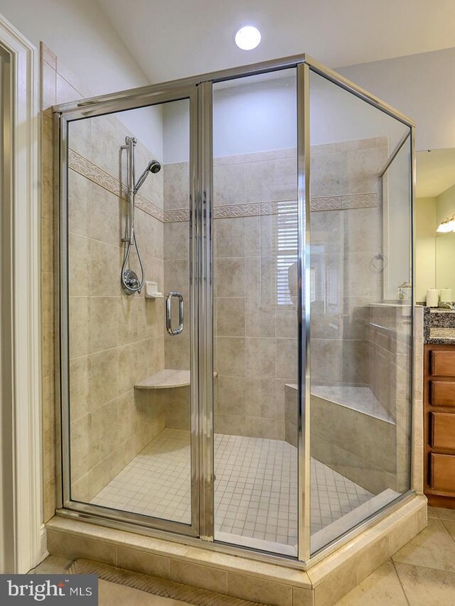 37529 Atlantic Ave Unit 11, Rehoboth Beach, DE 19971 - bathroom with tile patterned flooring, vanity, a shower stall, and recessed lighting