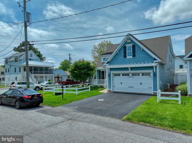 37529 Atlantic Ave Unit 11, Rehoboth Beach, DE 19971 - view of front facade with driveway and a shingled roof